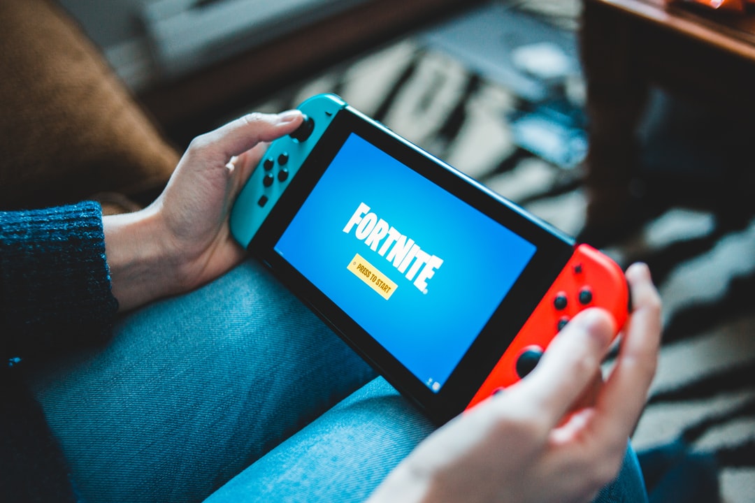 Black and Red nintendo switch playing Fortnite - Unsplash